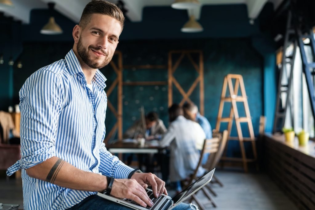 Man Working At Laptop In Contemporary Office Professional Services
